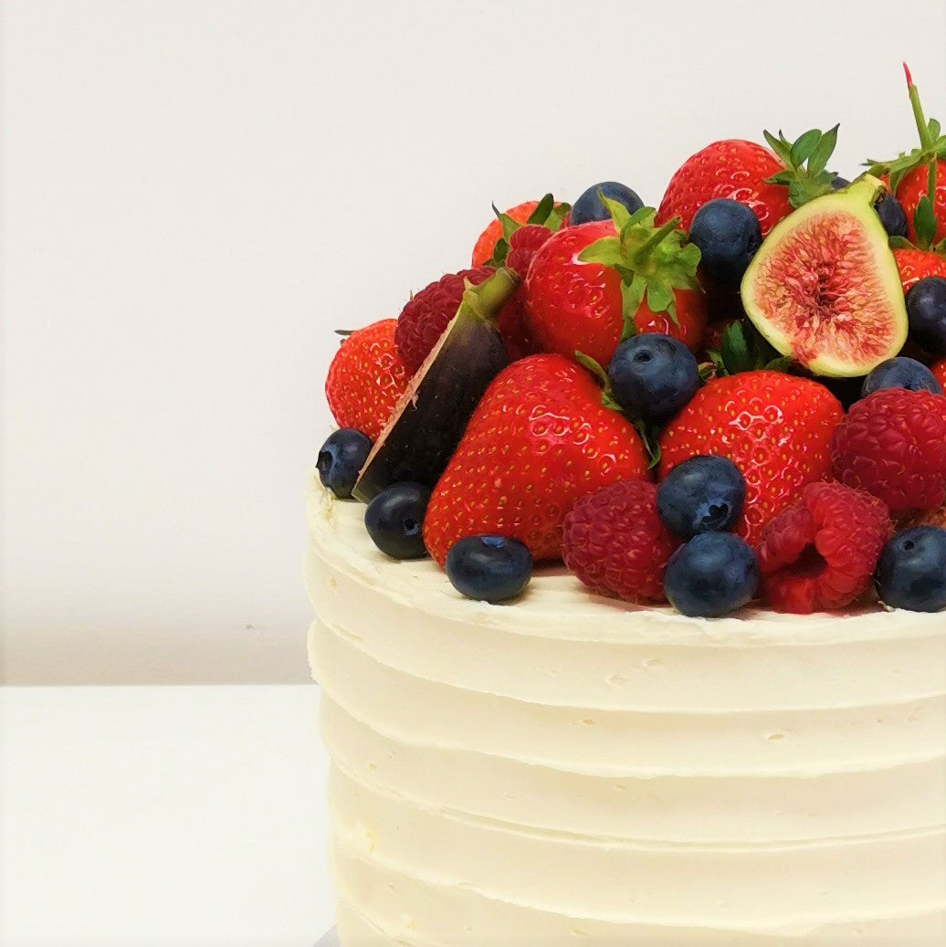 Buttercream cake topped with fresh berries